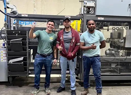 Higgins operators posing with the Cubemaster 200